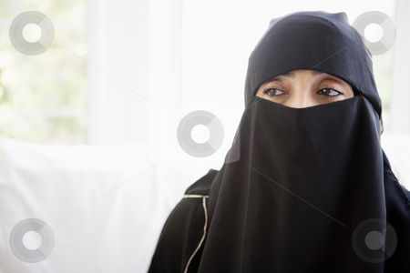To use this stock image in your creative project, please select the size you need over to the right and click the "Add to Cart" button.
Your downloaded image will come with the Cutcaster watermark removed so don’t worry about the watermark you see on this page. Portrait of a middle eastern woman wearing a black hijab stock photo, by Monkey Business Images