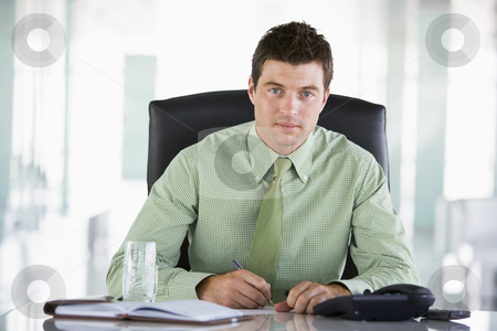 To use this stock image in your creative project, please select the size you need over to the right and click the "Add to Cart" button.
Your downloaded image will come with the Cutcaster watermark removed so don’t worry about the watermark you see on this page. Businessman sitting in office with personal organizer stock photo, by Monkey Business Images