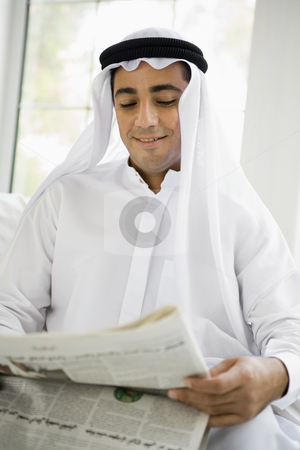To use this stock image in your creative project, please select the size you need over to the right and click the "Add to Cart" button.
Your downloaded image will come with the Cutcaster watermark removed so don’t worry about the watermark you see on this page. A Middle Eastern man reading a newspaper stock photo, by Monkey Business Images