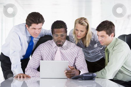 To use this stock image in your creative project, please select the size you need over to the right and click the "Add to Cart" button.
Your downloaded image will come with the Cutcaster watermark removed so don’t worry about the watermark you see on this page. Four businesspeople in a boardroom looking at laptop stock photo, by Monkey Business Images
