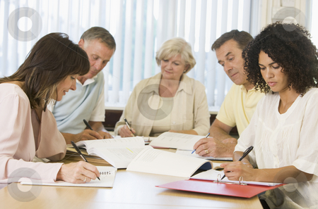 To use this stock image in your creative project, please select the size you need over to the right and click the "Add to Cart" button.
Your downloaded image will come with the Cutcaster watermark removed so don’t worry about the watermark you see on this page. Adult students studying together stock photo, by Monkey Business Images