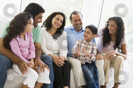 To use this stock image in your creative project, please select the size you need over to the right and click the "Add to Cart" button.
Your downloaded image will come with the Cutcaster watermark removed so don’t worry about the watermark you see on this page. A Middle Eastern family sitting together on a couch stock photo, by Monkey Business Images