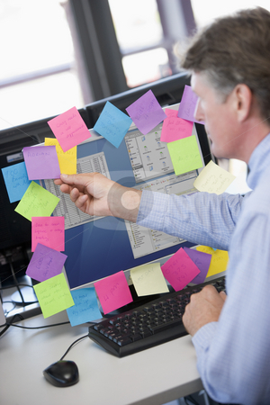 To use this stock image in your creative project, please select the size you need over to the right and click the "Add to Cart" button.
Your downloaded image will come with the Cutcaster watermark removed so don’t worry about the watermark you see on this page. Businessman in office at monitor with notes on it stock photo, by Monkey Business Images