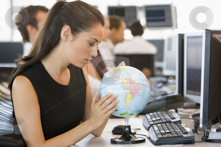 To use this stock image in your creative project, please select the size you need over to the right and click the "Add to Cart" button.
Your downloaded image will come with the Cutcaster watermark removed so don’t worry about the watermark you see on this page. Businesswoman in office space with desk globe stock photo, by Monkey Business Images