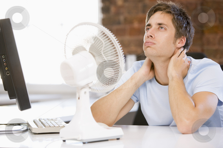 To use this stock image in your creative project, please select the size you need over to the right and click the "Add to Cart" button.
Your downloaded image will come with the Cutcaster watermark removed so don’t worry about the watermark you see on this page. Businessman in office with computer and fan cooling off stock photo, by Monkey Business Images