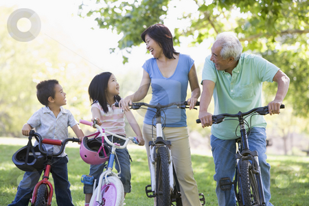 To use this stock image in your creative project, please select the size you need over to the right and click the "Add to Cart" button.
Your downloaded image will come with the Cutcaster watermark removed so don’t worry about the watermark you see on this page. Grandparents bike riding with grandchildren stock photo, by Monkey Business Images