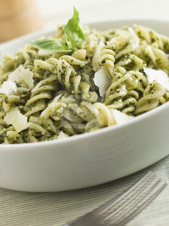 To use this stock image in your creative project, please select the size you need over to the right and click the "Add to Cart" button.
Your downloaded image will come with the Cutcaster watermark removed so don’t worry about the watermark you see on this page. Bowl of Fusilli Pasta dressed in Pesto with Parmesan Shaves stock photo, by Monkey Business Images