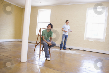 To use this stock image in your creative project, please select the size you need over to the right and click the "Add to Cart" button.
Your downloaded image will come with the Cutcaster watermark removed so don’t worry about the watermark you see on this page. Two men in empty space with ladder holding paper stock photo, by Monkey Business Images