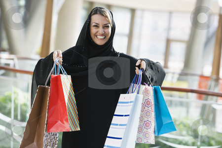 To use this stock image in your creative project, please select the size you need over to the right and click the "Add to Cart" button.
Your downloaded image will come with the Cutcaster watermark removed so don’t worry about the watermark you see on this page. A Middle Eastern woman in a shopping mall stock photo, by Monkey Business Images