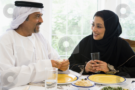 To use this stock image in your creative project, please select the size you need over to the right and click the "Add to Cart" button.
Your downloaded image will come with the Cutcaster watermark removed so don’t worry about the watermark you see on this page. A Middle Eastern couple enjoying a meal stock photo, by Monkey Business Images