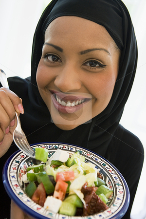 To use this stock image in your creative project, please select the size you need over to the right and click the "Add to Cart" button.
Your downloaded image will come with the Cutcaster watermark removed so don’t worry about the watermark you see on this page. A Middle Eastern woman with a plate of salad stock photo, by Monkey Business Images