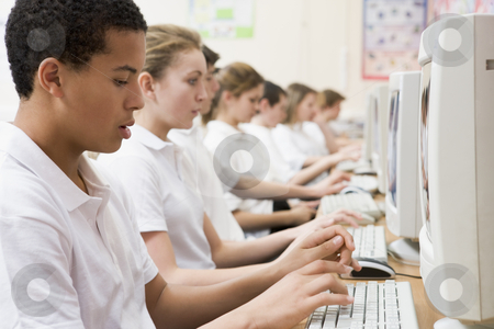 To use this stock image in your creative project, please select the size you need over to the right and click the "Add to Cart" button.
Your downloaded image will come with the Cutcaster watermark removed so don’t worry about the watermark you see on this page. Row of schoolchildren studying in front of a computer stock photo, by Monkey Business Images