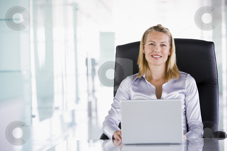 To use this stock image in your creative project, please select the size you need over to the right and click the "Add to Cart" button.
Your downloaded image will come with the Cutcaster watermark removed so don’t worry about the watermark you see on this page. Businesswoman sitting in office with laptop smiling stock photo, by Monkey Business Images