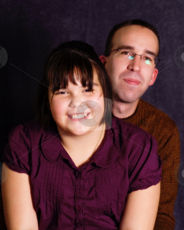 To use this stock image in your creative project, please select the size you need over to the right and click the "Add to Cart" button.
Your downloaded image will come with the Cutcaster watermark removed so don’t worry about the watermark you see on this page. Father Daughter Portrait stock photo, A young father and his daughter, getting their portrait done together by Richard Nelson