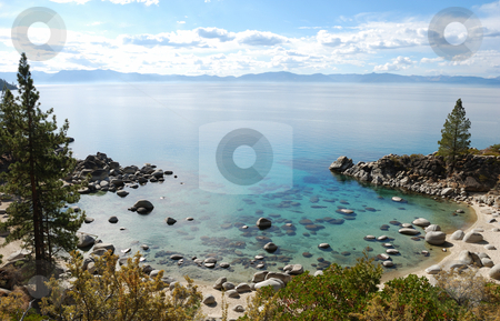 To use this stock image in your creative project, please select the size you need over to the right and click the "Add to Cart" button.
Your downloaded image will come with the Cutcaster watermark removed so don’t worry about the watermark you see on this page. Crystal Clear Water Bay on Lake Tahoe stock photo, Crystal Clear Water Bay on Lake Tahoe with Sunny Skies by Denis Radovanovic