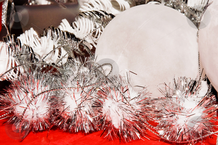 To use this stock image in your creative project, please select the size you need over to the right and click the "Add to Cart" button.
Your downloaded image will come with the Cutcaster watermark removed so don’t worry about the watermark you see on this page. Xmas decoration ornaments stock photo, Xmas decoration ornaments in white and silver and red by Karin Claus