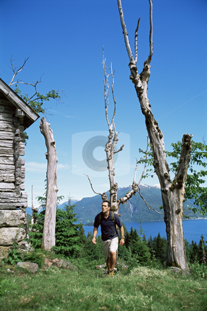 To use this stock image in your creative project, please select the size you need over to the right and click the "Add to Cart" button.
Your downloaded image will come with the Cutcaster watermark removed so don’t worry about the watermark you see on this page. Man hiking up to a wooden cabin stock photo, by Monkey Business Images