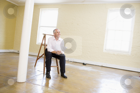 To use this stock image in your creative project, please select the size you need over to the right and click the "Add to Cart" button.
Your downloaded image will come with the Cutcaster watermark removed so don’t worry about the watermark you see on this page. Man sitting on ladder in empty space holding paper smiling stock photo, by Monkey Business Images