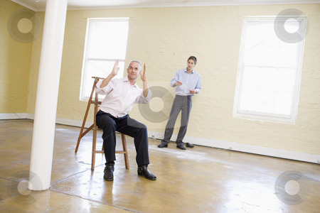 To use this stock image in your creative project, please select the size you need over to the right and click the "Add to Cart" button.
Your downloaded image will come with the Cutcaster watermark removed so don’t worry about the watermark you see on this page. Two men with ladder in empty space making plans for room stock photo, by Monkey Business Images