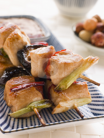To use this stock image in your creative project, please select the size you need over to the right and click the "Add to Cart" button.
Your downloaded image will come with the Cutcaster watermark removed so don’t worry about the watermark you see on this page. Yakitori Skewers with Sukiyaki Sauce and Rice Crackers stock photo, Plate of Yakitori Skewers with Sukiyaki Sauce and Rice Crackers by Monkey Business Images