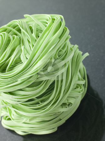 To use this stock image in your creative project, please select the size you need over to the right and click the "Add to Cart" button.
Your downloaded image will come with the Cutcaster watermark removed so don’t worry about the watermark you see on this page. Stack of Spinach Noodles on a Black Background stock photo, Close up of Stack of Spinach Noodles on a Black Background by Monkey Business Images