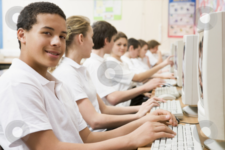 To use this stock image in your creative project, please select the size you need over to the right and click the "Add to Cart" button.
Your downloaded image will come with the Cutcaster watermark removed so don’t worry about the watermark you see on this page. Row of schoolchildren studying in front of a computer stock photo, by Monkey Business Images