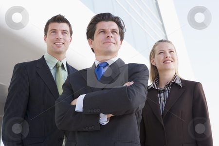 To use this stock image in your creative project, please select the size you need over to the right and click the "Add to Cart" button.
Your downloaded image will come with the Cutcaster watermark removed so don’t worry about the watermark you see on this page. Three businesspeople standing outdoors by building smiling stock photo, by Monkey Business Images