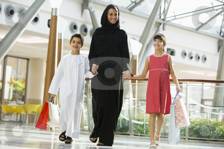 To use this stock image in your creative project, please select the size you need over to the right and click the "Add to Cart" button.
Your downloaded image will come with the Cutcaster watermark removed so don’t worry about the watermark you see on this page. A Middle Eastern woman with two children in a shopping mall stock photo, by Monkey Business Images