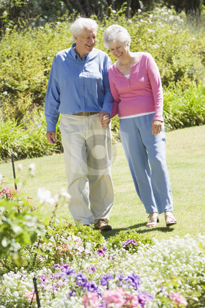 To use this stock image in your creative project, please select the size you need over to the right and click the "Add to Cart" button.
Your downloaded image will come with the Cutcaster watermark removed so don’t worry about the watermark you see on this page. Senior couple walking in garden stock photo, Senior couple walking in garden admiring flowerbeds by Monkey Business Images