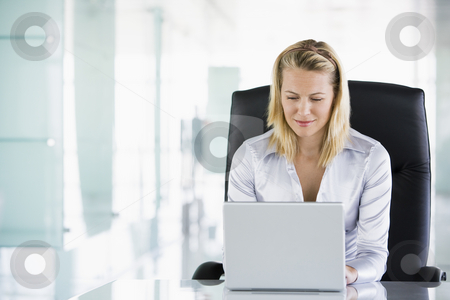 To use this stock image in your creative project, please select the size you need over to the right and click the "Add to Cart" button.
Your downloaded image will come with the Cutcaster watermark removed so don’t worry about the watermark you see on this page. Businesswoman in office using laptop stock photo, by Monkey Business Images