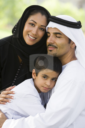 To use this stock image in your creative project, please select the size you need over to the right and click the "Add to Cart" button.
Your downloaded image will come with the Cutcaster watermark removed so don’t worry about the watermark you see on this page. A Middle Eastern couple and their son sitting in a park stock photo, by Monkey Business Images