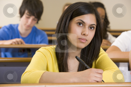 To use this stock image in your creative project, please select the size you need over to the right and click the "Add to Cart" button.
Your downloaded image will come with the Cutcaster watermark removed so don’t worry about the watermark you see on this page. Female college student listening to a university lecture stock photo, by Monkey Business Images