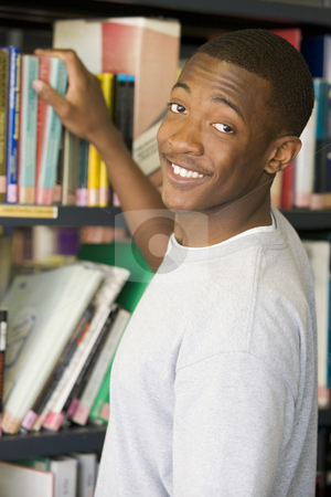 To use this stock image in your creative project, please select the size you need over to the right and click the "Add to Cart" button.
Your downloaded image will come with the Cutcaster watermark removed so don’t worry about the watermark you see on this page. Male college student reaching for a library book stock photo, by Monkey Business Images