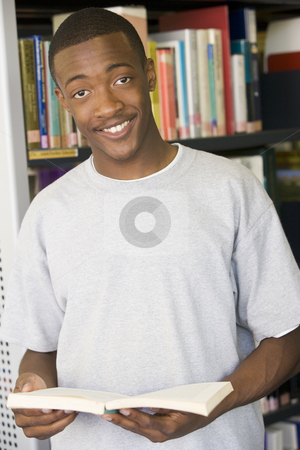To use this stock image in your creative project, please select the size you need over to the right and click the "Add to Cart" button.
Your downloaded image will come with the Cutcaster watermark removed so don’t worry about the watermark you see on this page. Male college student reading in a library stock photo, by Monkey Business Images
