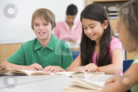 To use this stock image in your creative project, please select the size you need over to the right and click the "Add to Cart" button.
Your downloaded image will come with the Cutcaster watermark removed so don’t worry about the watermark you see on this page. Group of elementary school pupils in classroom stock photo, Group of elementary school pupils in classroom reading by Monkey Business Images