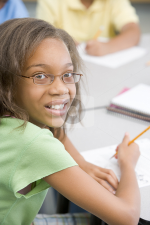 To use this stock image in your creative project, please select the size you need over to the right and click the "Add to Cart" button.
Your downloaded image will come with the Cutcaster watermark removed so don’t worry about the watermark you see on this page. Elementary school pupil stock photo, Elementary school pupil working at desk by Monkey Business Images