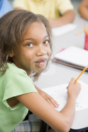 To use this stock image in your creative project, please select the size you need over to the right and click the "Add to Cart" button.
Your downloaded image will come with the Cutcaster watermark removed so don’t worry about the watermark you see on this page. Elementary school pupil at desk stock photo, Elementary school pupil working at desk by Monkey Business Images