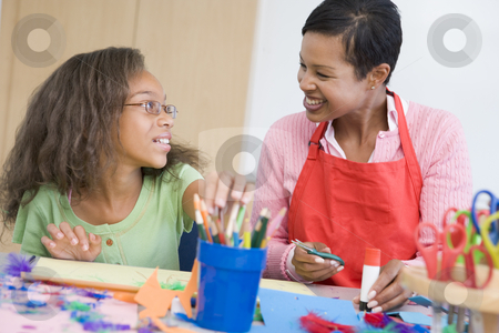 To use this stock image in your creative project, please select the size you need over to the right and click the "Add to Cart" button.
Your downloaded image will come with the Cutcaster watermark removed so don’t worry about the watermark you see on this page. Elementary school art class stock photo, Teacher with pupil in art class by Monkey Business Images