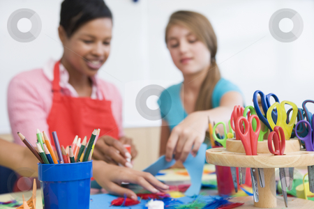 To use this stock image in your creative project, please select the size you need over to the right and click the "Add to Cart" button.
Your downloaded image will come with the Cutcaster watermark removed so don’t worry about the watermark you see on this page. Elementary school art class stock photo, Elementary school art class with teacher by Monkey Business Images