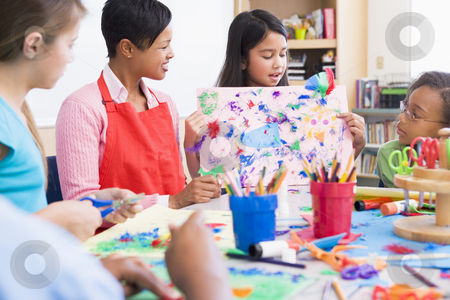 To use this stock image in your creative project, please select the size you need over to the right and click the "Add to Cart" button.
Your downloaded image will come with the Cutcaster watermark removed so don’t worry about the watermark you see on this page. Elementary school pupil in art class stock photo, Elementary school pupil in art class showing picture to classmates by Monkey Business Images