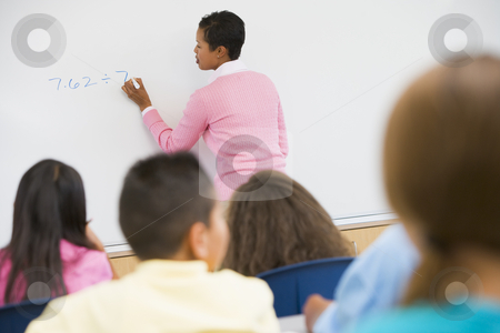 To use this stock image in your creative project, please select the size you need over to the right and click the "Add to Cart" button.
Your downloaded image will come with the Cutcaster watermark removed so don’t worry about the watermark you see on this page. Elementary school maths class stock photo, Elementary school teacher holding maths class by Monkey Business Images