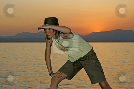 To use this stock image in your creative project, please select the size you need over to the right and click the "Add to Cart" button.
Your downloaded image will come with the Cutcaster watermark removed so don’t worry about the watermark you see on this page. Indiana Jones stock photo, Indiana Jones in Lazise, 12 years old girl at the lake of Garda, Italy by Lothar Hinz