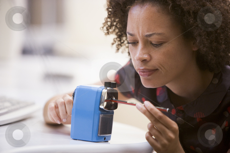 To use this stock image in your creative project, please select the size you need over to the right and click the "Add to Cart" button.
Your downloaded image will come with the Cutcaster watermark removed so don’t worry about the watermark you see on this page. Woman in computer room using pencil sharpener stock photo, by Monkey Business Images