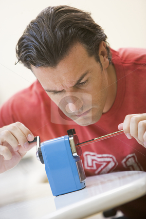 To use this stock image in your creative project, please select the size you need over to the right and click the "Add to Cart" button.
Your downloaded image will come with the Cutcaster watermark removed so don’t worry about the watermark you see on this page. Man indoors using pencil sharpener stock photo, by Monkey Business Images
