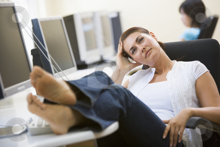 To use this stock image in your creative project, please select the size you need over to the right and click the "Add to Cart" button.
Your downloaded image will come with the Cutcaster watermark removed so don’t worry about the watermark you see on this page. Woman in computer room with feet up thinking stock photo, by Monkey Business Images