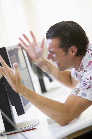 To use this stock image in your creative project, please select the size you need over to the right and click the "Add to Cart" button.
Your downloaded image will come with the Cutcaster watermark removed so don’t worry about the watermark you see on this page. Man in computer room frustrated at monitor stock photo, by Monkey Business Images