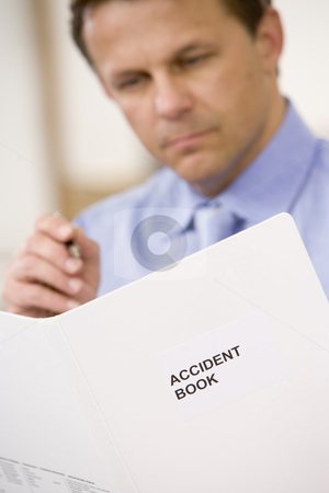 To use this stock image in your creative project, please select the size you need over to the right and click the "Add to Cart" button.
Your downloaded image will come with the Cutcaster watermark removed so don’t worry about the watermark you see on this page. Businessman indoors looking at Accident Book stock photo, by Monkey Business Images