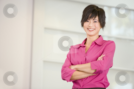 To use this stock image in your creative project, please select the size you need over to the right and click the "Add to Cart" button.
Your downloaded image will come with the Cutcaster watermark removed so don’t worry about the watermark you see on this page. Businesswoman standing indoors smiling stock photo, by Monkey Business Images