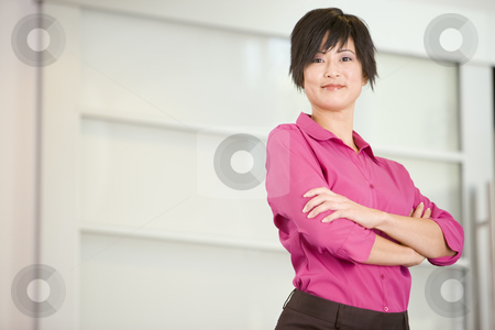 To use this stock image in your creative project, please select the size you need over to the right and click the "Add to Cart" button.
Your downloaded image will come with the Cutcaster watermark removed so don’t worry about the watermark you see on this page. Businesswoman standing indoors smiling stock photo, by Monkey Business Images