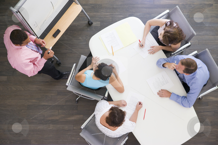 To use this stock image in your creative project, please select the size you need over to the right and click the "Add to Cart" button.
Your downloaded image will come with the Cutcaster watermark removed so don’t worry about the watermark you see on this page. Four businesspeople at boardroom table watching presentation stock photo, by Monkey Business Images